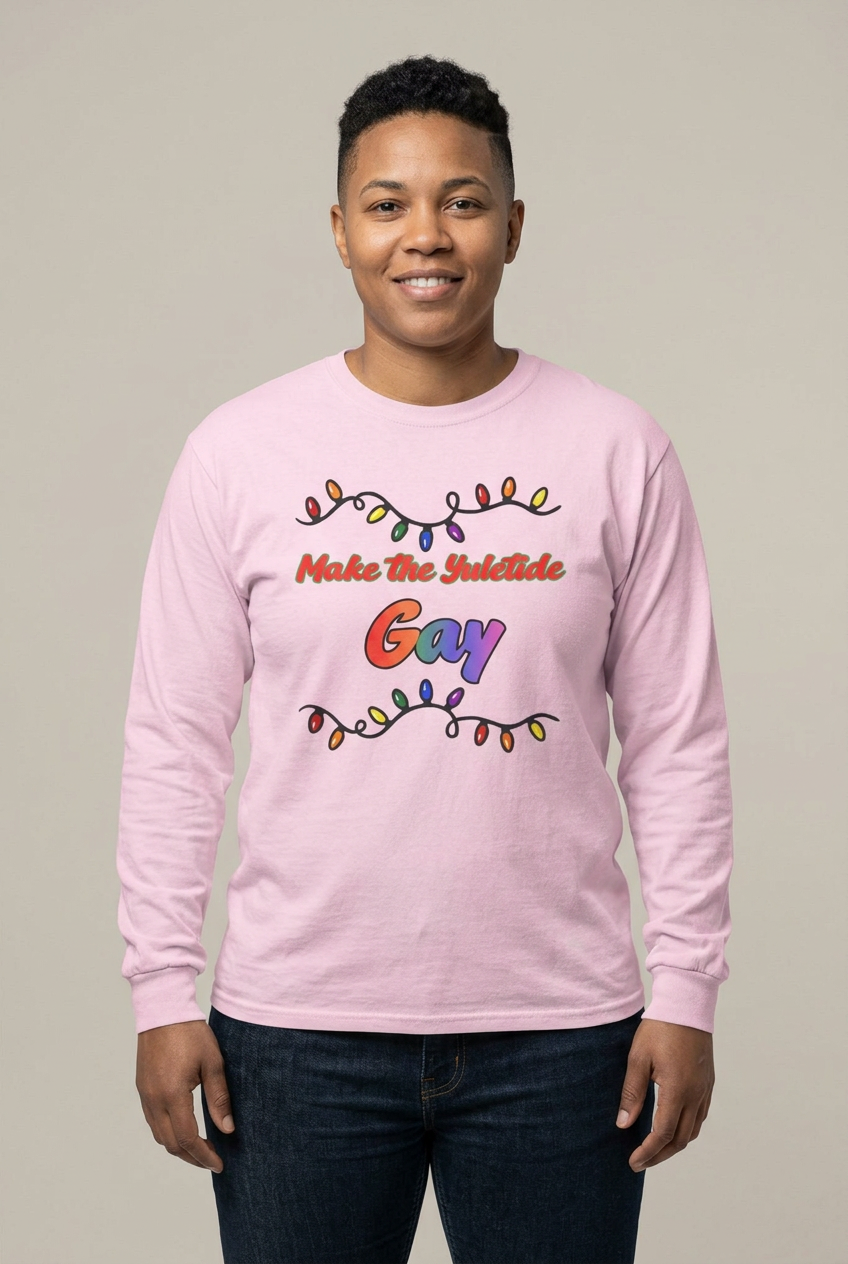 Butch female model wearing the Light Pink Yuletide Gay tee